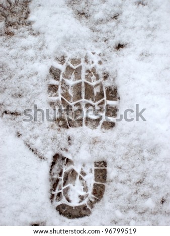 elevated view of footprint on snow covered ground