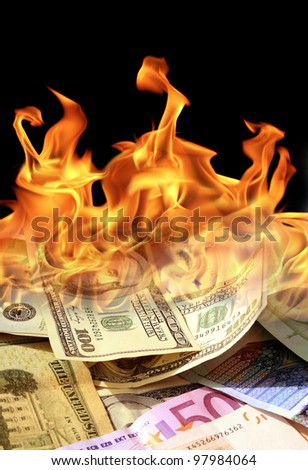 an image of  dollar and euro bills on fire