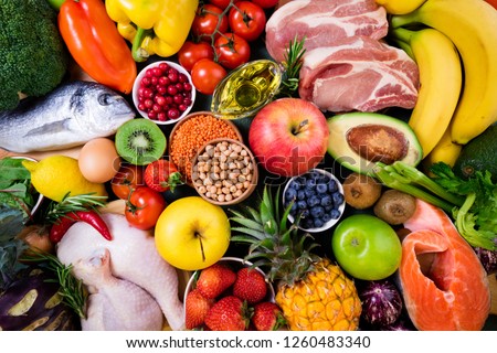 Background healthy food. Fresh fruits, vegetables, meat and fish on table. Healthy food, diet and healthy life concept. Top view
