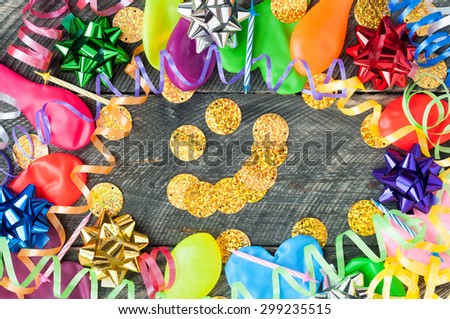 Happy birthday backgrounds. Balloons, streamers, ribbons, bows, candles and smile on wooden table