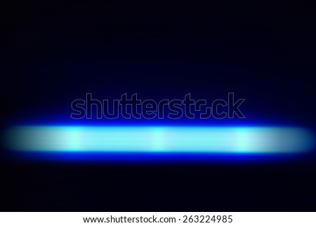 This this neon blue banner of light glows on a black background.The luminosity draws the eye making the beam seem like it pulses.