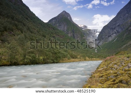 The powerful Briksdal Glacier is a part of the Jostedal Glacier National Park. The wild glacier swoops down from a height of 1200m to the lush, narrow Briksdal Valley.