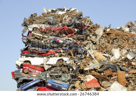 A heap of scrap Cars waiting to be shipped for recycling.