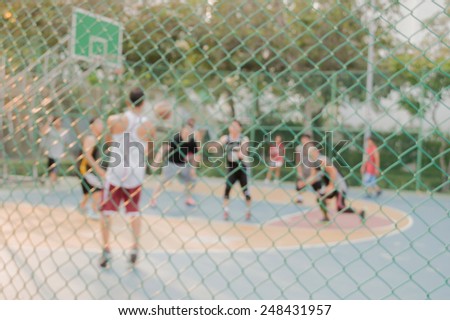 High key blurred image for background of street basketball players on the basketball court work out in the evening