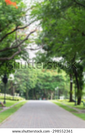 Defocused and blurred image for background of walkway in public park