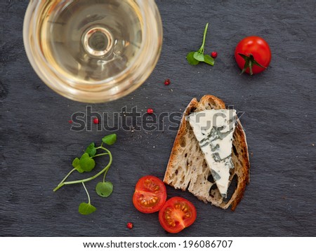 Still life with bread, cheese and glass of wine