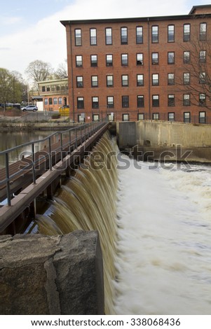 Dam on the Charles River, with the historic Boston Manufacturing Company mill building in the background, in Waltham, Massachusetts.