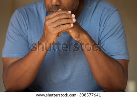 Man in deep thought. Distraught.  Prayer.