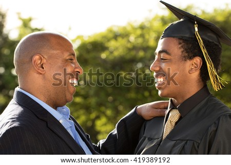 Proud African American father talking with his son.