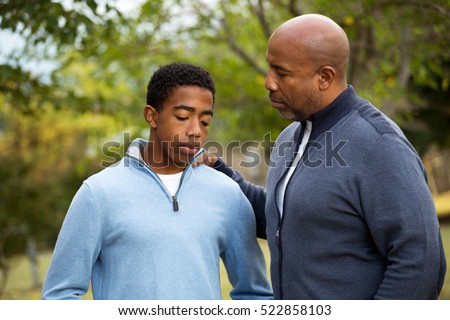 African American father parenting his son.
