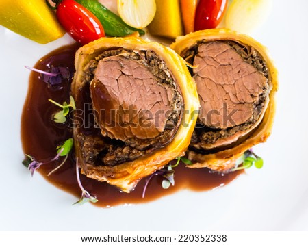 Famous dish, beef wellington with red wine sauce