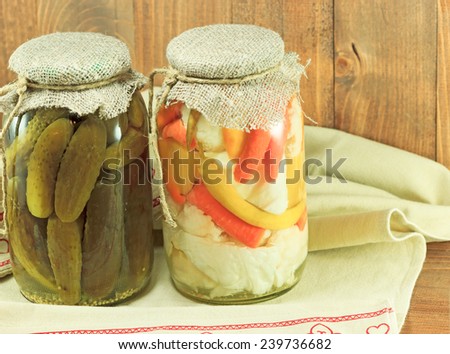 Mixed pickled vegetables in glass jars