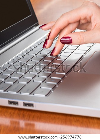 Hand of the woman typing on computer