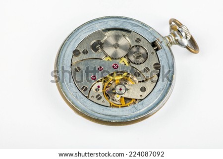 Old pocket watch without a lid with a clockwork