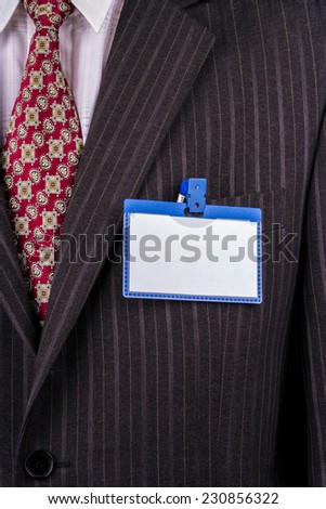 Blank badge blue plastic on a business suit manager