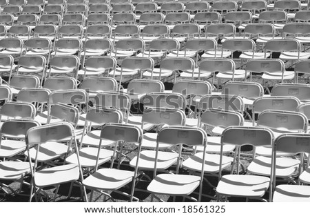 rows of white folding chairs