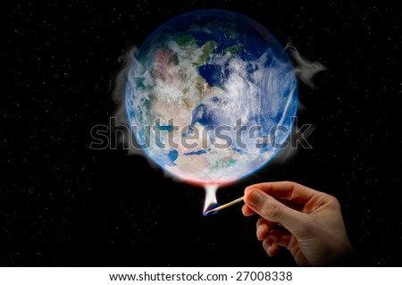 Global Warming a hand holding a match warming the globe