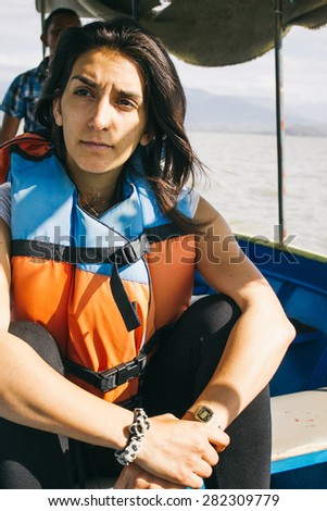 Woman sitting on a boat during a trip