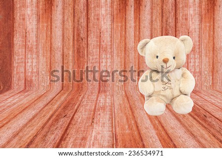 wood wall and teddy bear