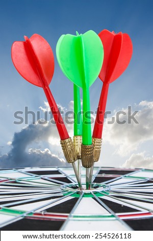 Sport Dart go to target and success on blue sky background
