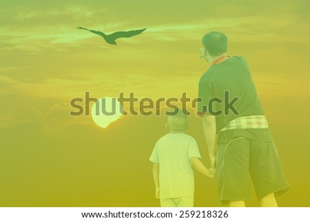 Double Exposure Effect green screen of sunset father and son point look at eagle bird fly on sky