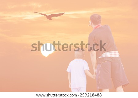 Double Exposure Effect pink screen of sunset father and son point look at eagle bird fly on sky
