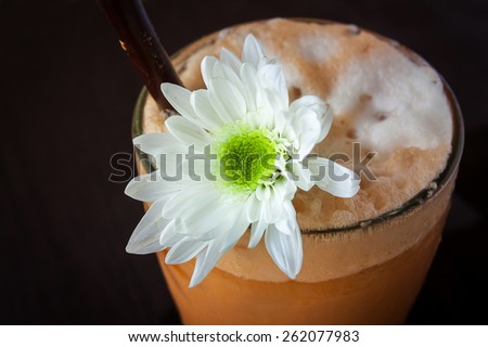 Iced Milk Tea  on a wooden table in summer