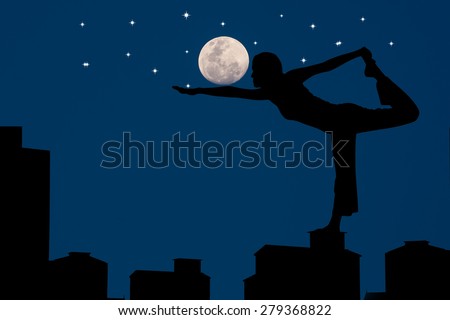Silhouette young woman practicing yoga on the Old buildings at the full moon
