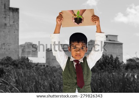 Green returns to nature,people, ecology, biology and environment concept,the boy hand hold show paper hand hold tree on old buildings background and arid Hay death