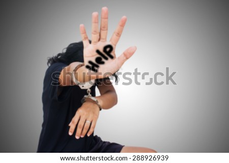 blurry women hand in handcuff show hand symbol help  ,Slave-Human Trafficking concept
