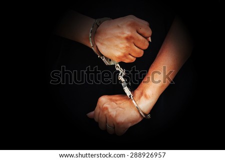 concept human trafficking,hand girl in shackle on isolate black background