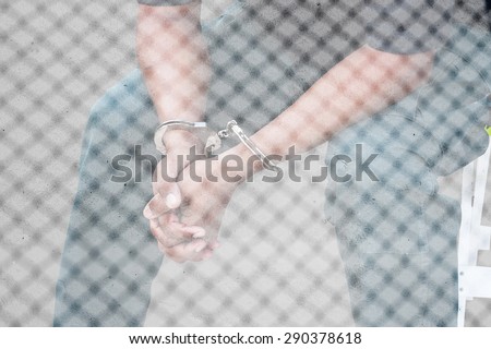 double exposure of  the man was bound by hand in the handcuffed out of freedom
