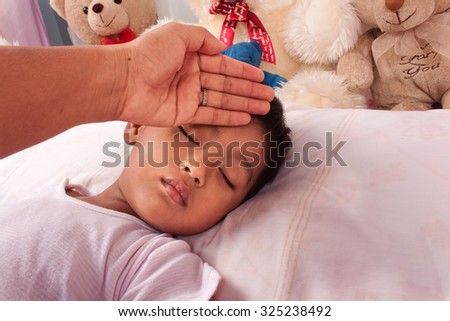 a little asian boy sick mother take care