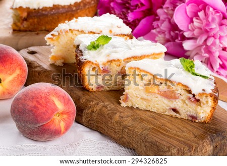 Three pieces of peach pie on a wooden board