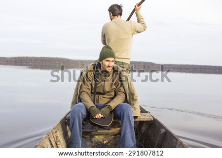Men in boat on the river, rowing, adventure, real