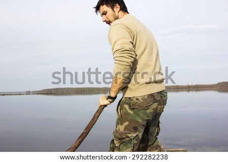 Man in boat on the river, rowing, adventure, real