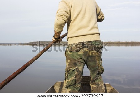 Man in boat on the river, rowing, adventure, real