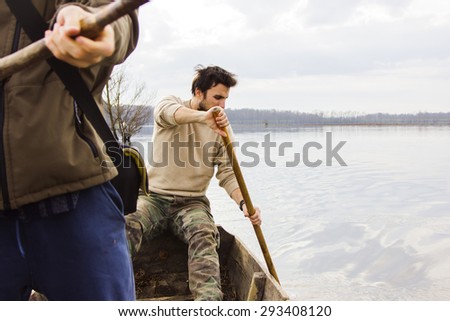 Men in boat on the river, rowing, adventure, real