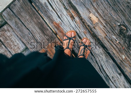 Feet on the wood floor