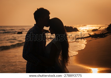 Love story. Couple on the sunset
