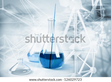 laboratory flask on abstract science background