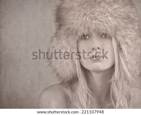 textured old paper background with woman in winter clothes