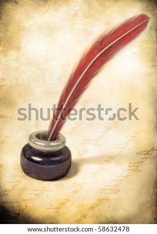 quill pen on vintage paper background