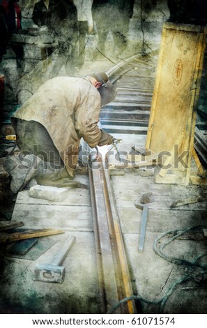 worker with protective mask and gloves welding train rail and sparks spreading -  picture in retro style