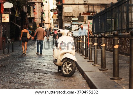 Vintage scooter in old street in Naples, Italy.