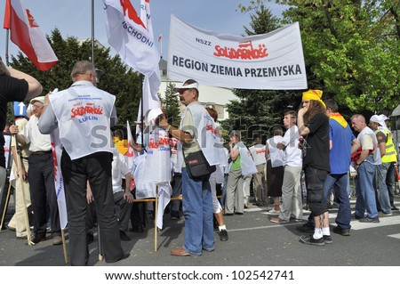 WARSAW, POLAND - MAY 11: Unidentified members of trade union, protest against pension reform. The protest was organized by Solidarity trade union, outside parliament on May 11, 2012 in Warsaw, Poland