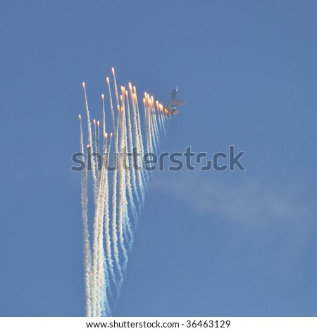 RADOM - AUGUST 28: Twin-engined jet fighter plane SU-27 performs showy pyrotechnical display on the sky August 28, 2009 in Radom, Poland. Two days later, this plane crashed during the Air Show.