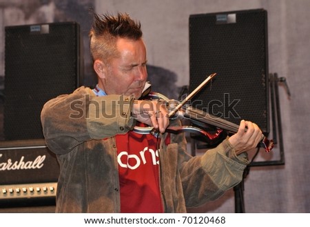 WARSAW - SEPTEMBER 04: Nigel Kennedy performs on stage at The Jewish Cultural Festival on September 04, 2010 in Warsaw, Poland.