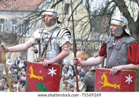 GORA KALWARIA - APRIL 17: Reenactment of the Roman legionaries, standing on guard, during the street performances Mystery of the Passion on April 17, 2011 in Gora Kalwaria, Poland.