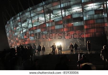 WARSAW - OCTOBER 02: Trial illumination of the facade, during The Grand Open Day at the National Stadium on October 02, 2011 in Warsaw, Poland.